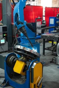 Automatic Industrial welding robot in a modern factory Stock Photos