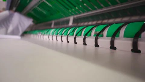 Automatic ironing line in industrial laundry Stock Footage 171326764