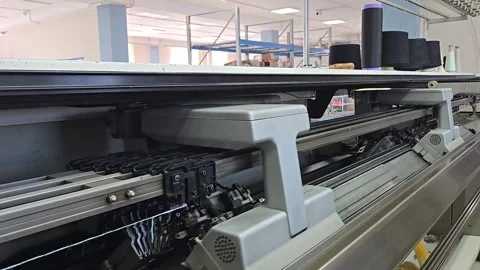 Automatic knitting machine in operation in knitwear workshop at factory Stock Footage 334571809