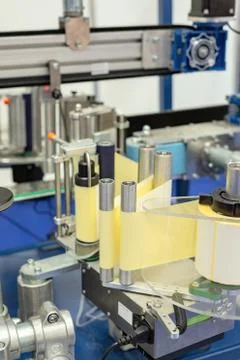 Automatic labeling machine. Stock Photos