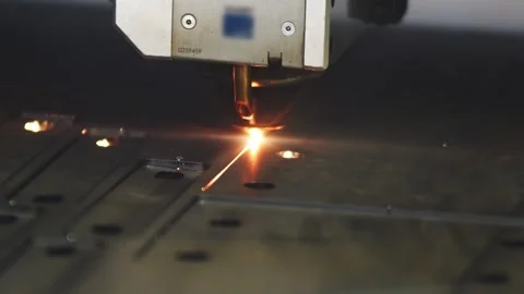 Automatic laser cutting machine slowly cutting part with holes with sparkling Stock Footage 225846974