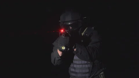 Automatic with laser sight. The soldier holds a laser sight on the target Stock Footage 96714802
