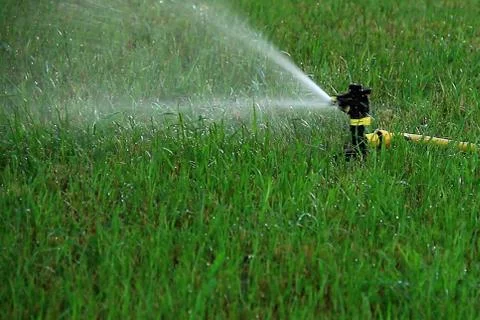 Automatic lawn watering Stock Photos