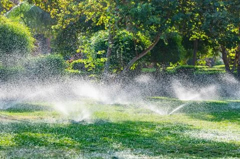 Automatic lawn watering Stock Photos