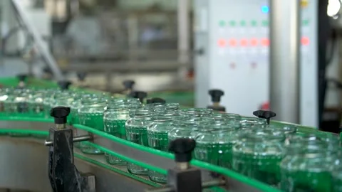 Automatic Line empty Glass cans for Processing of Vegetables. Glass jars on a Stock Footage 165774061