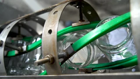 Automatic Line empty Glass cans for Processing of Vegetables. Glass jars on a Stock Footage 165774622