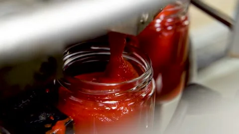 Automatic Line for Processing of Vegetables. Glass jars with vegetables pasta on Stock Footage 165775317