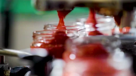 Automatic Line for Processing of Vegetables. Glass jars with vegetables pasta on Stock Footage 165776862