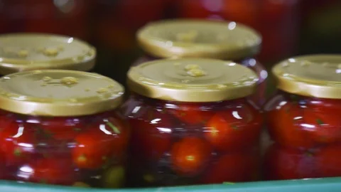 Automatic Line for Processing of Vegetables. Preserving Tomatoes and cucumbers Stock Footage 127856762