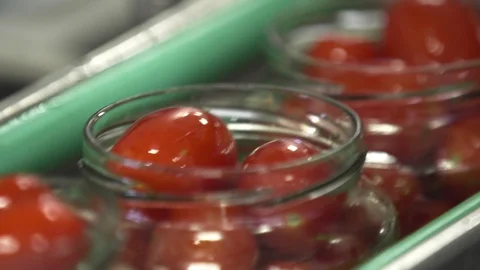 Automatic Line for Processing of Vegetables. Preserving Tomatoes and cucumbers Stock Footage 127857598