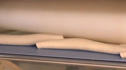 Automatic line of thin dough Stock Footage 105402529