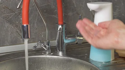 Automatic liquid soap dispenser. Man washes his hands under the tap. Stock Footage 165507007