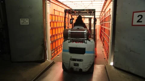 An Automatic Loader Loads The Finished, Packaged Products into A Truck. Video stock 197334814