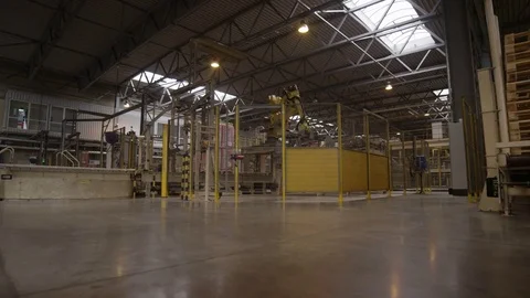 Automatic Loader Turns and Rearranges Boxes in Shop Stock Footage 73824261