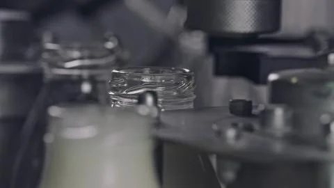 Automatic machine capping glass bottles on production line Stock Illustration