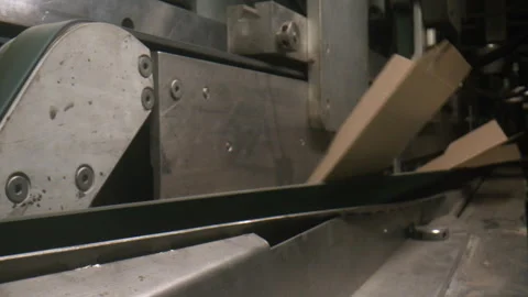 Automatic machine folds cardboard boxes in workshop Stock Footage 241893560