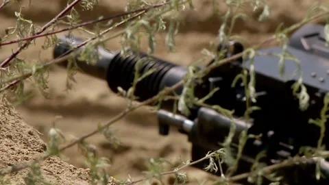 Automatic machine gun grenade launcher stands in a trench, focus transfer Video stock 153036950