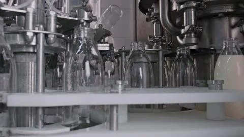 Automatic machine pouring milk into glass bottles in dairy factory Stock Illustration