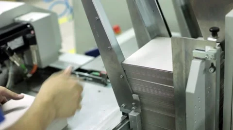 Automatic machine printing books, offset and photo printed products. Stock Footage 59842975