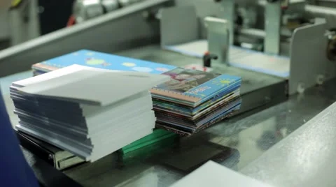 Automatic machine printing books, offset and photo printed products. Stock Footage 59842984