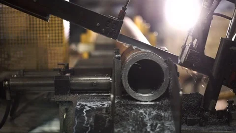 Automatic machine saws metal pipe Stock Footage 71506028