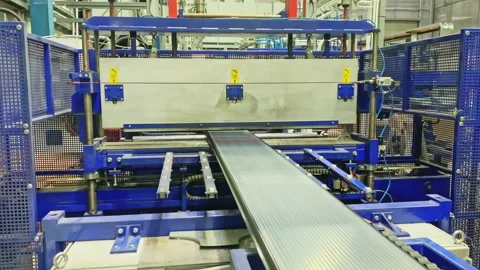 Automatic machine tool operates polycarbonate sheet Stock Footage 234426436