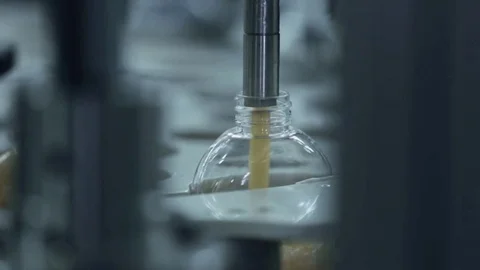 Automatic machine tool pours soap into the bottle Stock Footage 75179262