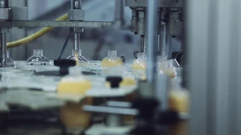 Automatic machine tool pours soap into the bottle Stock Footage 75926388