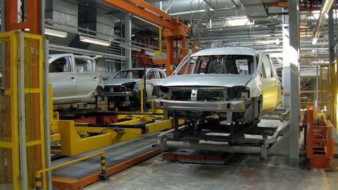 Automatic machines are transporting car bodies for construction and painting Stock Footage 89404119