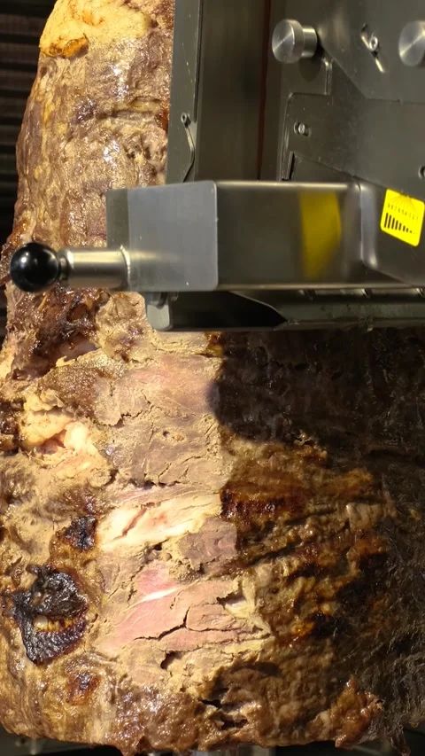 Automatic Meat Doner Slicing Machine Vertical Video Stock Footage 334872758