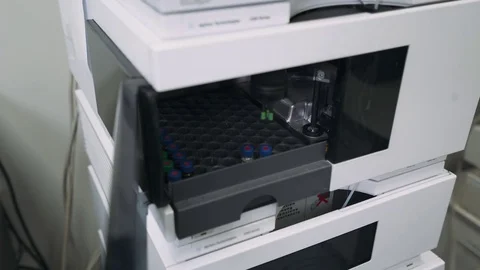 Automatic medical machine takes a sample of medicine from a test tube. Stock Footage 82252450