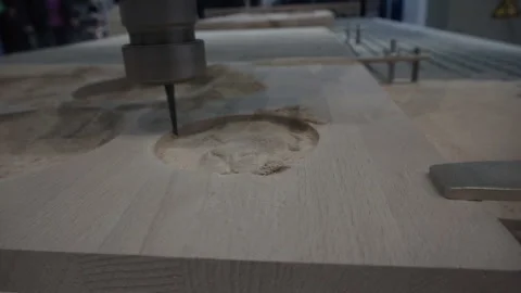 An automatic milling machine makes a lion-shaped wood pattern. Stock Footage 120871979