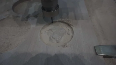 An automatic milling machine makes a lion-shaped wood pattern. Stock Footage 120872036