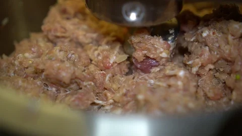 Automatic minced meat mixing using a kitchen machine, close up Stock Footage 121048495