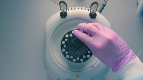 Automatic mixing in a centrifuge in a science lab Stock Footage 111607477