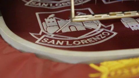 Automatic modern sewing machine embroider a logo on fabric.Industrial embroidery Video stock 115569203