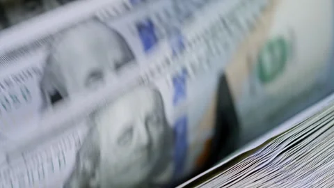 Automatic money counter rapidly processing stacks of 100 dollar bills. Symbol Stock Footage 340026309
