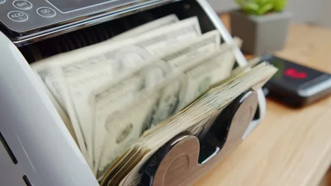 Automatic Money Counting Machine Processing Stacks Of US Dollar Bills Stock Footage 326171792