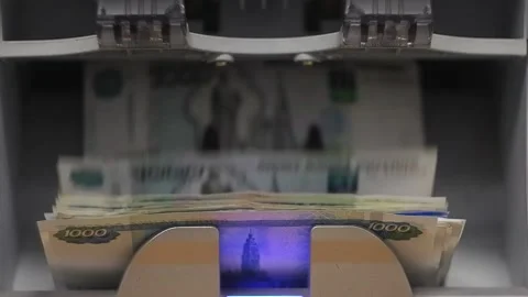 Automatic money counting machine.Russian banknotes on the counting machine. Stock Footage 149986286