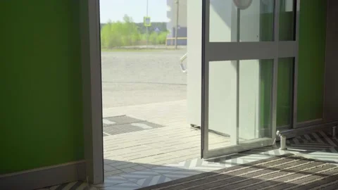 Automatic non-contact doors open and close. Close-up. Daylight sunlight Stock Footage 221125878