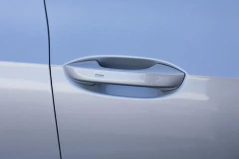 Automatic opening of a car door without a key. Keyless entry car door handle Photos