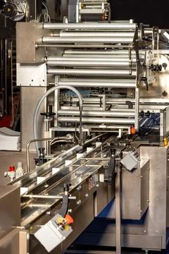 Automatic packaging conveyor line, vertical image. Stock Photos