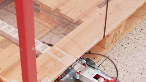 Automatic packer passing cord round empty box on fork pallet Stock Footage 119118213