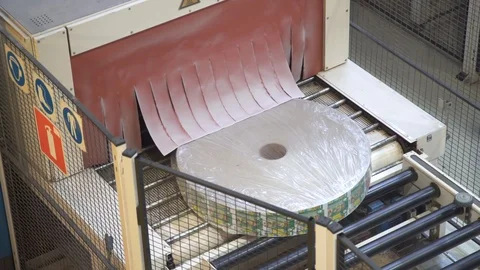 Automatic paper making machine. Roll of paper is on the tape Stock Footage 105343866