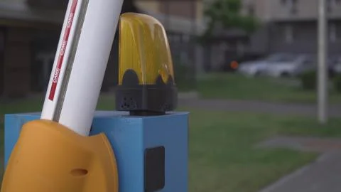 Automatic parking barrier is open to enter a private area,close-up,blinking l 스톡 사진