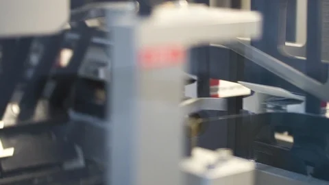 Automatic pill packaging in cardboard boxes at a pharmaceutical factory Stock Footage 120418343