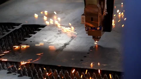 Automatic plasma cutter cuts holes in a metal product. Stock-Footage 167922862
