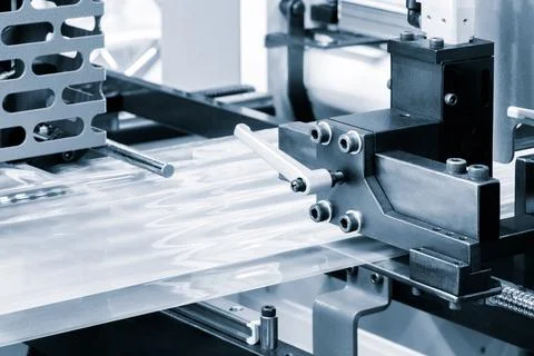 Automatic polyethylene plastic bag production machine with lighting effect. C 스톡 사진