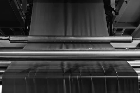 Automatic polyethylene plastic bag production machine with lighting effect. C Stock Photos