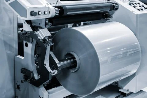 Automatic polyethylene plastic bag production machine with lighting effect. C Stock Photos